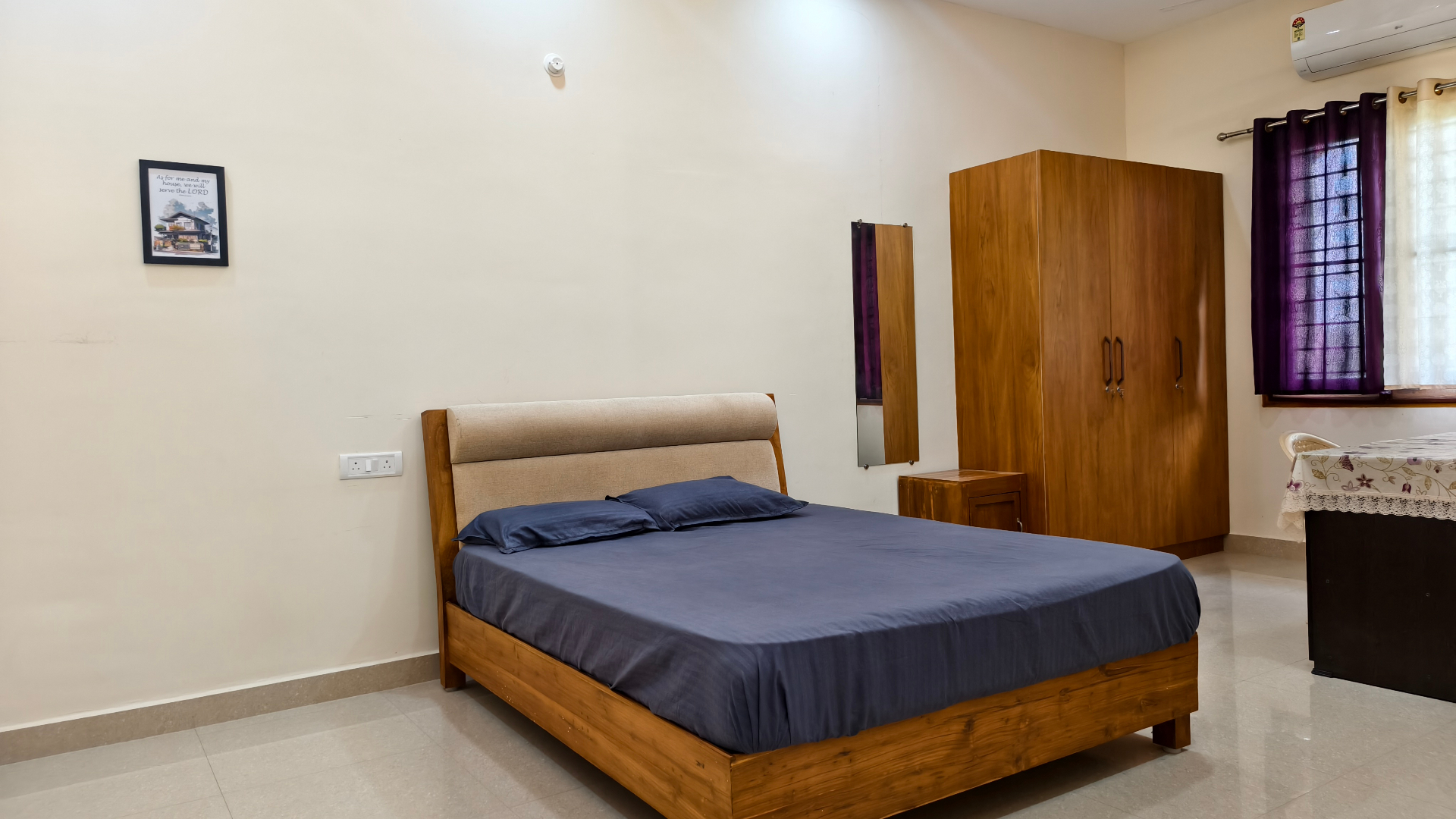 Deluxe guest bedroom at Krupa Sadanam in Chittoor